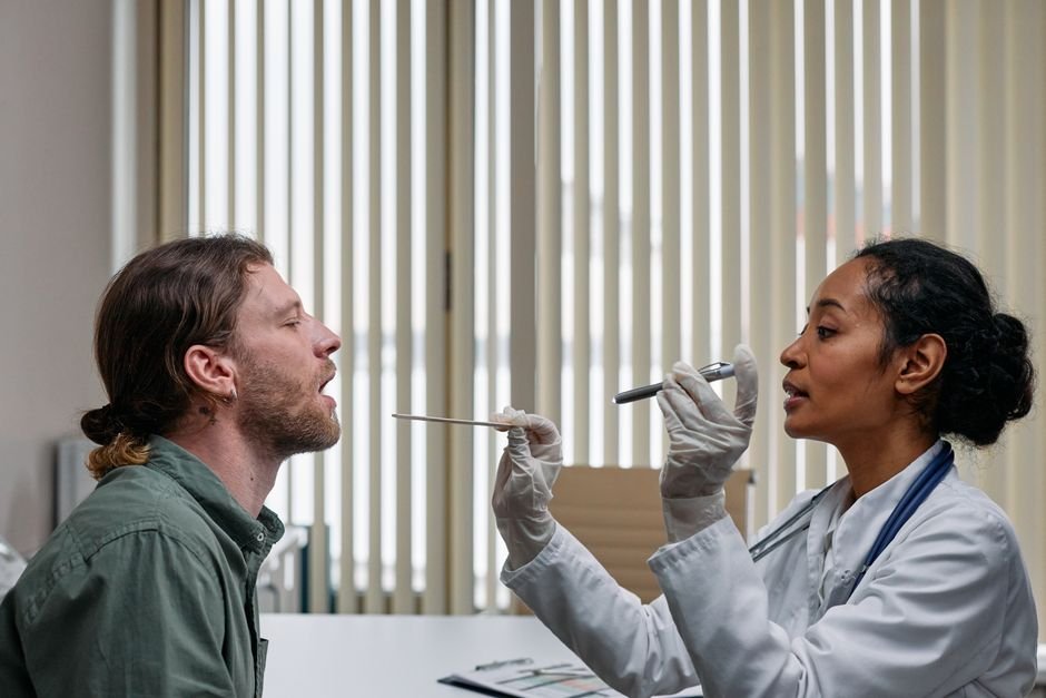 Aviation medical examiner examining a pilot during the FAA medical certificate exam.