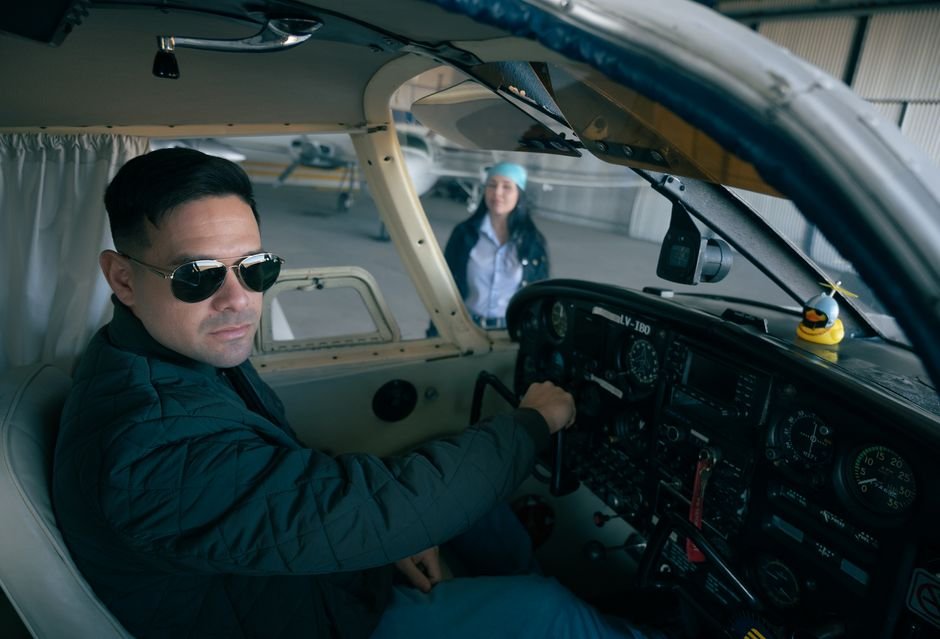 Student pilots preparing for a training flight at a Part 141 flight school.