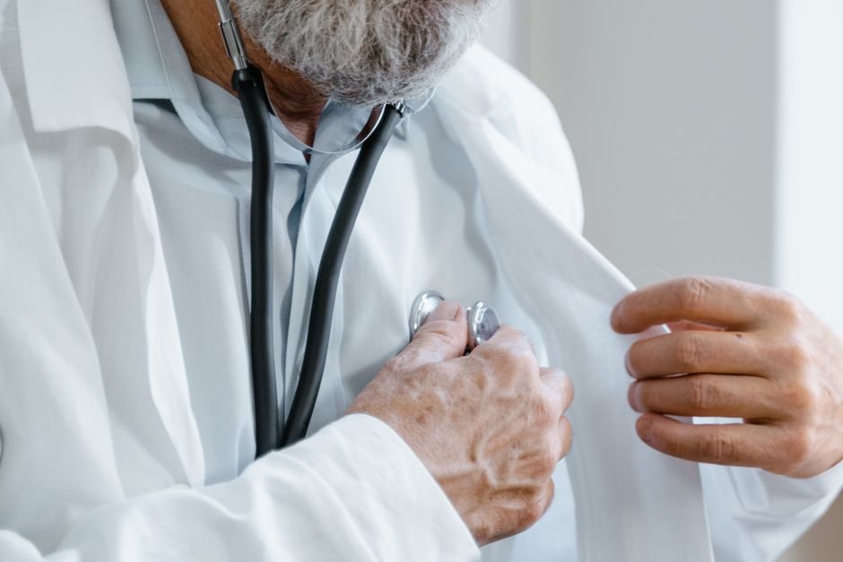 Physician performing a medical checkup as part of pilot training medical requirements.
