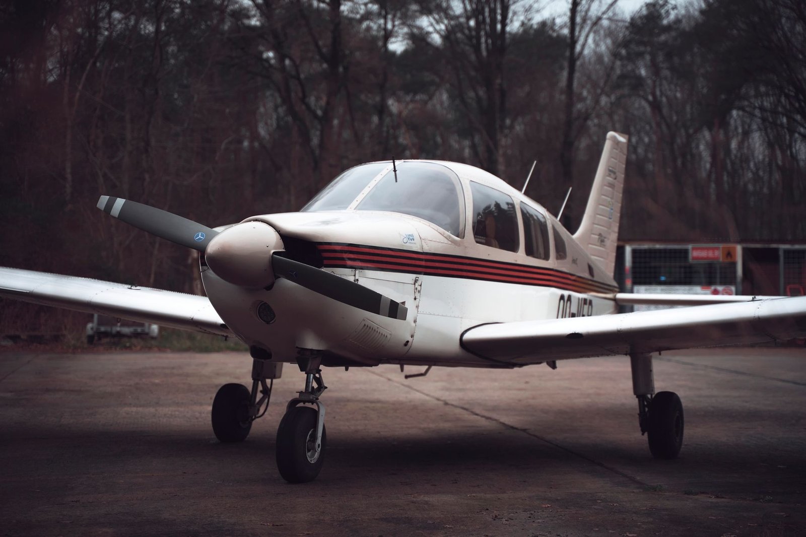 Small training aircraft parked on the ramp at a flight school