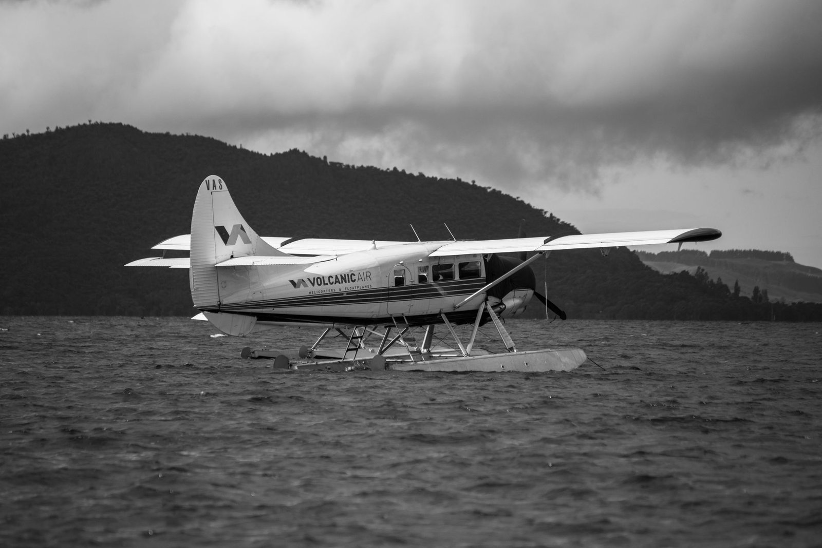 Float plane on a calm Canadian lake surrounded by forest