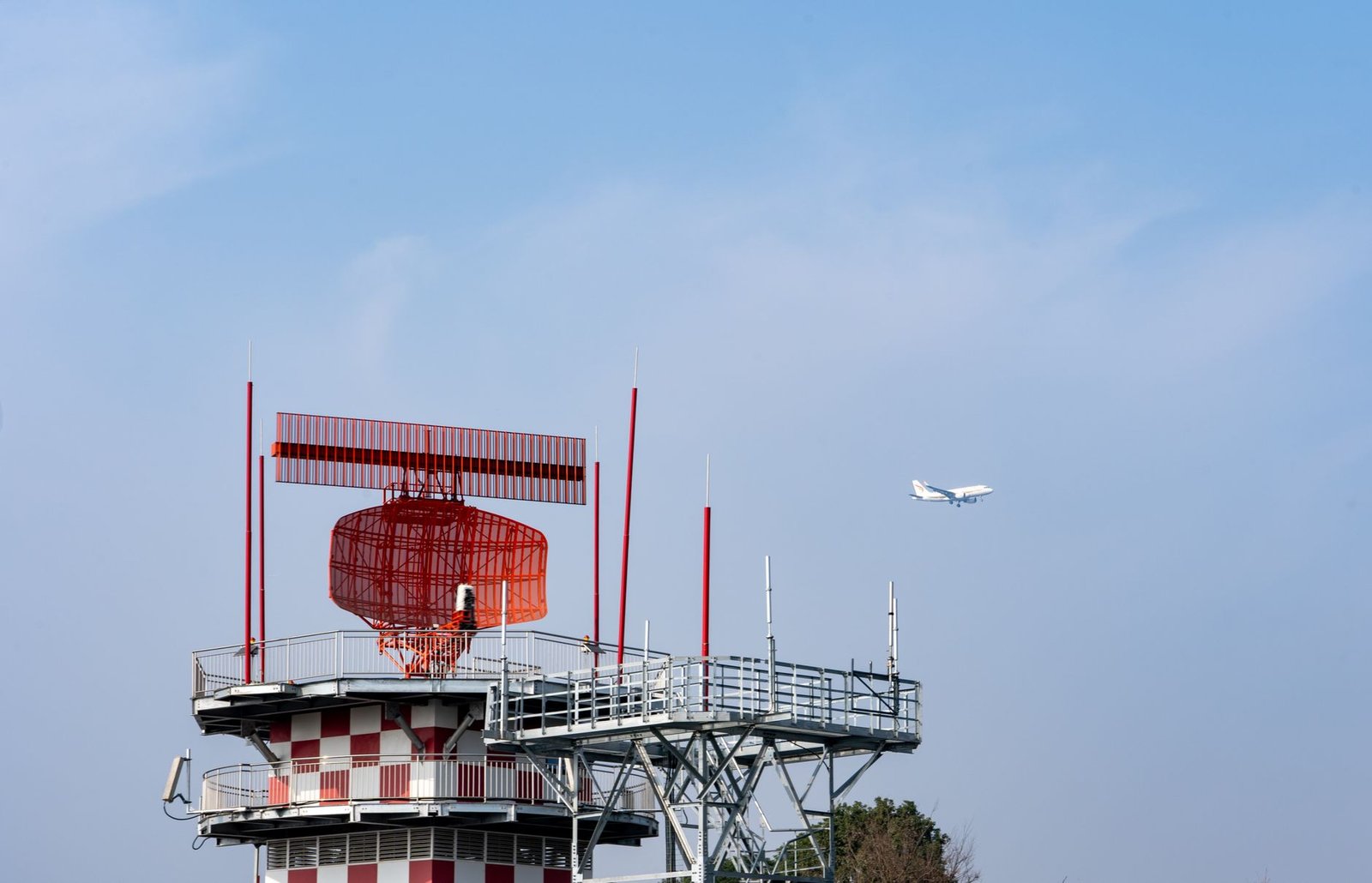 Airport radar control tower and aircraft representing air traffic control training at Pelican Flight Training