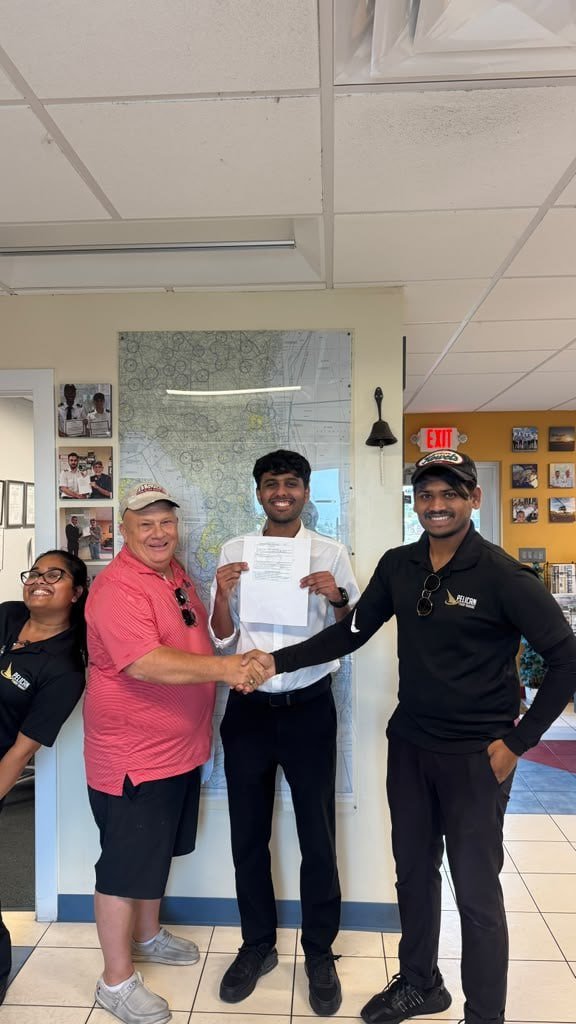 Moazzam celebrating a successful Instrument Rating checkride at Pelican Flight Training in Pembroke Pines