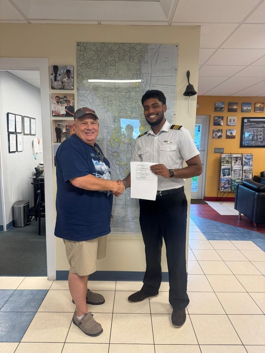 Pelican student Farhan with the examiner after passing his CFI checkride