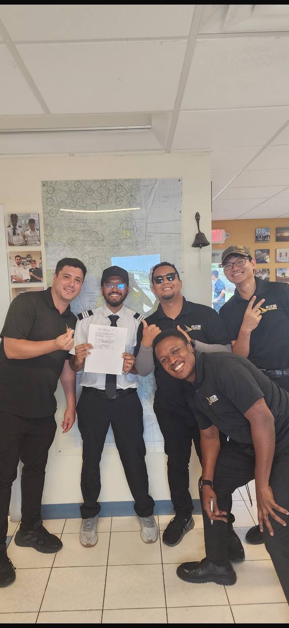 Pelican students celebrate a checkride pass