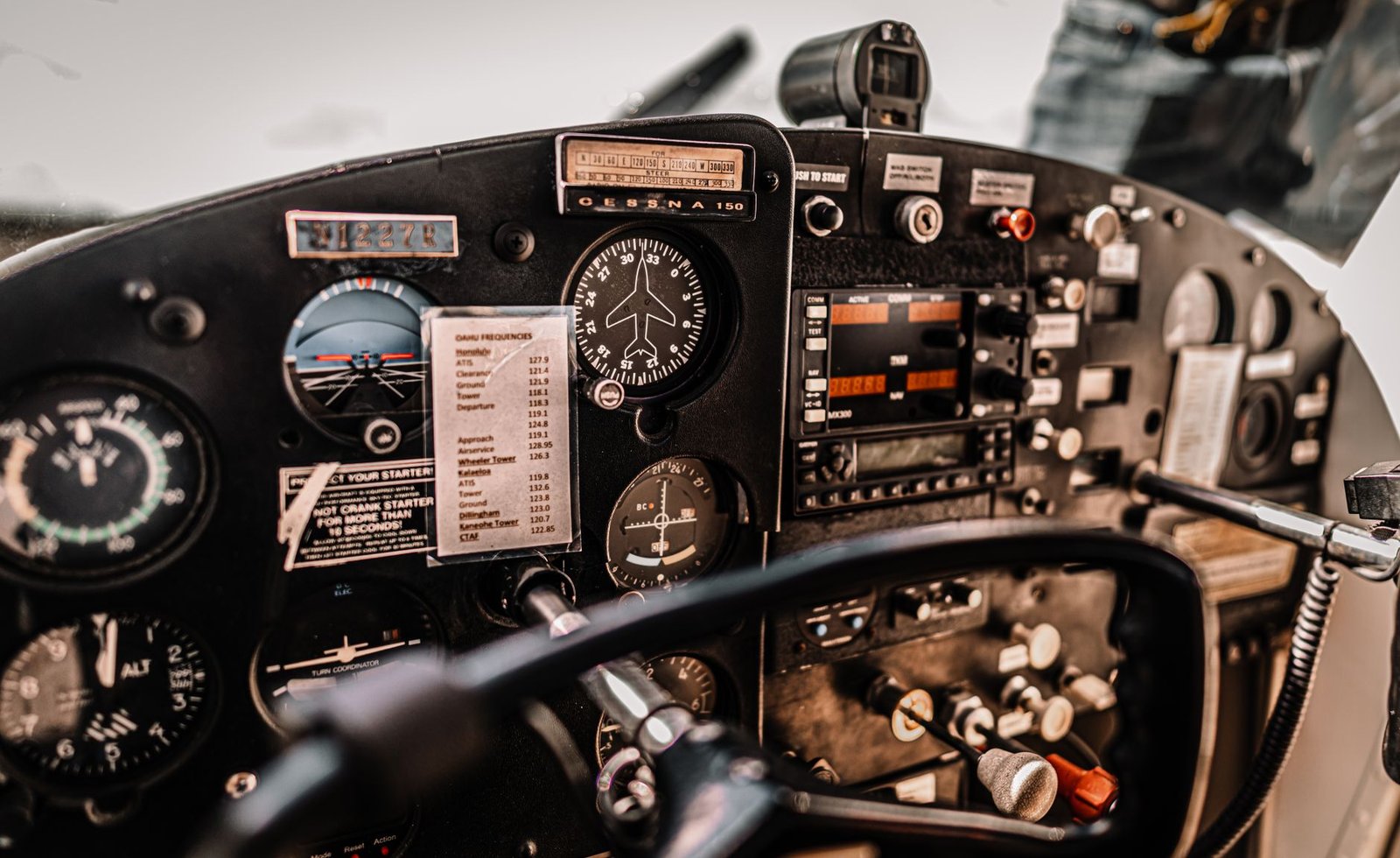 Student pilot in a light training aircraft cockpit transferring to Pelican Flight Training